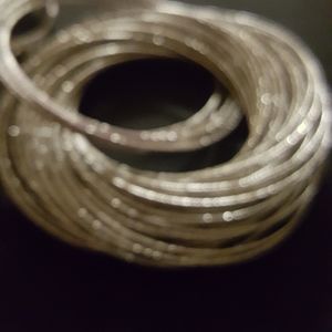 12 silver toned braclets